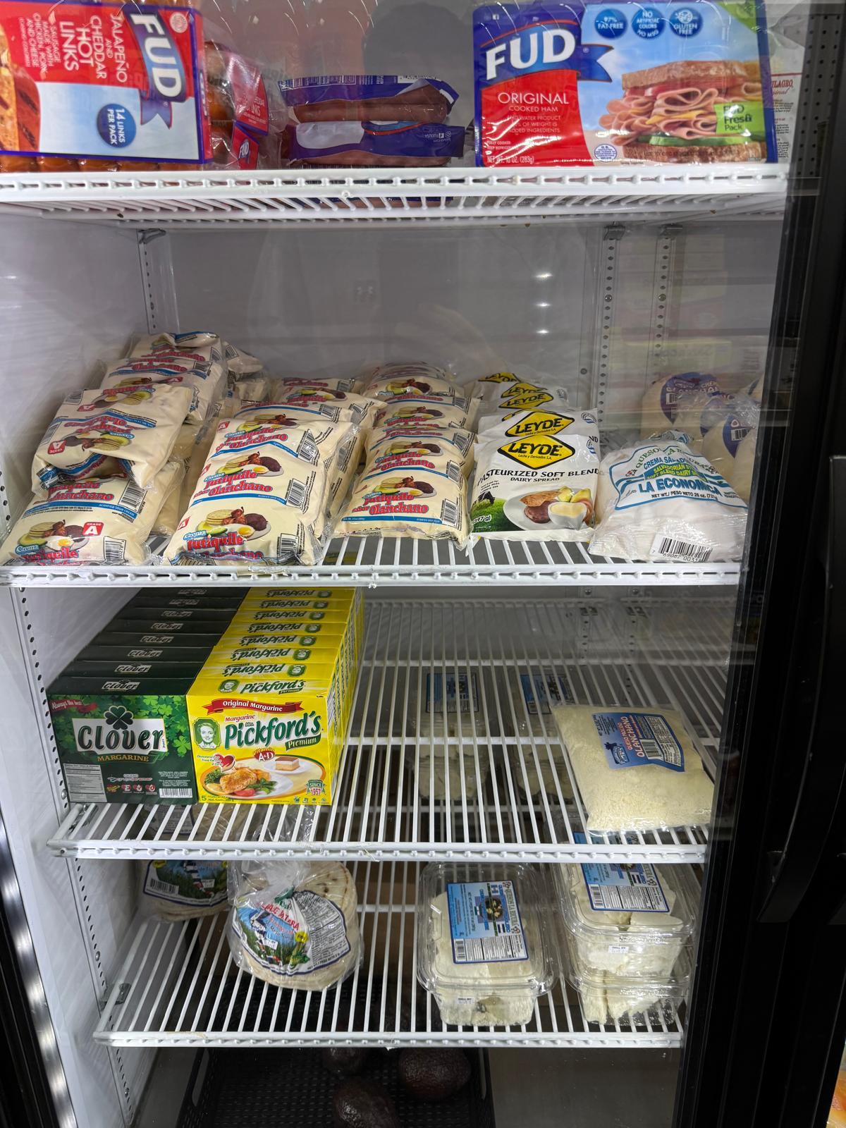 Dairy fridge with cheeses and butter